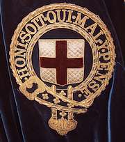 Badge met daarin het motto van de Orde van de Kousenband