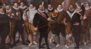 Het korporaalschap van kapitein Dirck Jacobsz Rosecrans en luitenant Pauw, Cornelis Ketel, 1588 (Publiek Domein - wiki Rijksmuseum) - De schutters dragen opgevulde wambuizen, met spleten. Om hun halzen dragen zij een plooikraag. De schoenen zijn smal naar de Spaanse mode, hun broeken wijd aan de heupen.