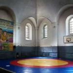 Horodenka, Galicië, Oekraïne, 2015. Voormalige grote synagoge, tegenwoordig een sporthal. Bron: Christian Hermann.