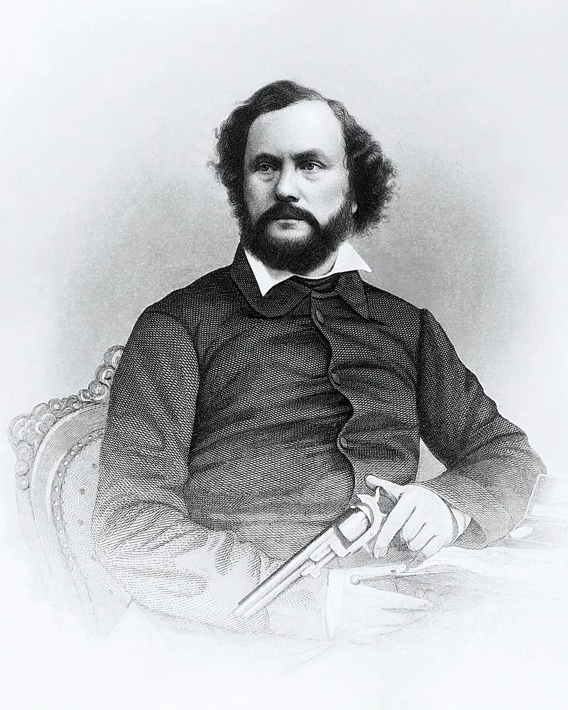 Samuel Colt in 1855 met in zijn hand de 'Colt 1851 Navy Revolver.'