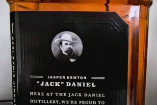 Portret van Jack Daniel op een fles whiskey