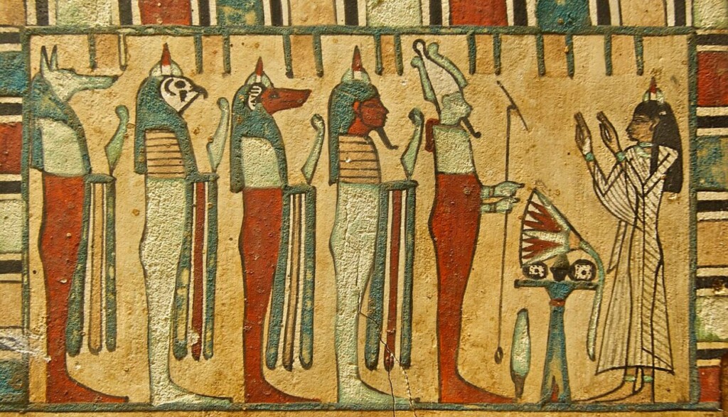 De zangeres van de god Amon brengt offers aan Osiris (vooraan) en de 'Vier Zonen van Horus'.